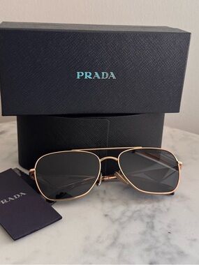 New Prada PR A50S (SVF09T) Sunglasses with Rose Gold Frame and Dark Gray Lenses